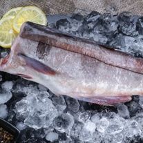 Пикша тушка потрошенная без головы свежемороженная